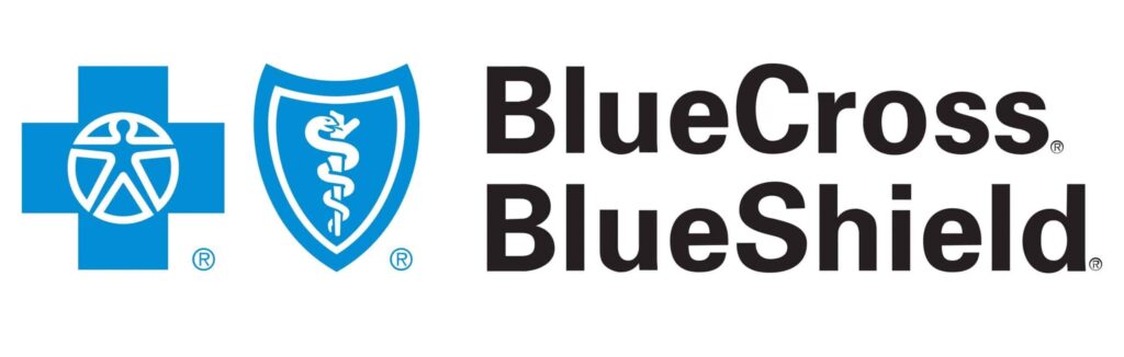 Blue Cross Blue Shield logo. Healthcare provider symbol with cross, figure, shield, and caduceus. Health insurance company.